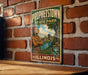 A vintage-style metal sign for "Protesttown State Park" in Illinois, featuring an illustration of a Native American figure and the text "Illinois State Parks".