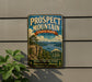 a vintage-style metal sign for Prospect Mountain State Park in New York, with a scenic mountain landscape and a cliff overlooking a lake.