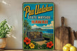 A vintage-style metal sign advertising Pu'uh Ualakaa State Wayside in Hawaii, featuring a tropical landscape with palm trees, flowers, and a sign for Pu'uh Ualakaa State Wayside.