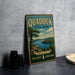 A vintage-style metal sign for Quaddick State Park in Connecticut, featuring a scenic landscape with a lake and mountains.