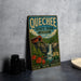 A vintage metal sign for Quechhee State Park in Vermont, featuring a scenic illustration of a waterfall and a red-roofed cabin.