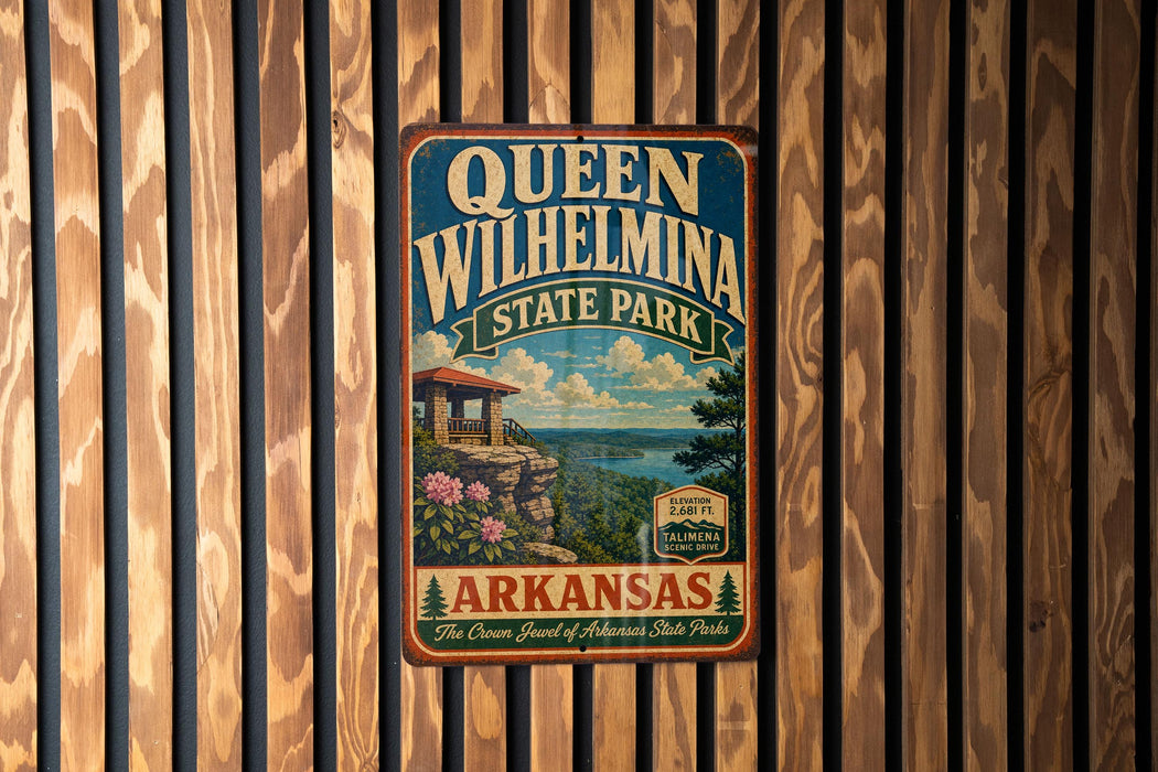 A vintage-style metal sign for Queen Wilhelmina State Park in Arkansas, featuring a scenic landscape with a cabin and mountains in the background.