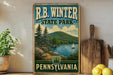 A vintage-style poster for R.B. Winter State Park in Pennsylvania, featuring a scenic landscape with a lake, mountains, and a sailboat.