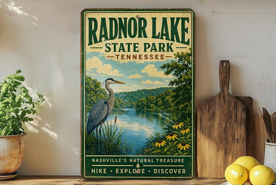 A vintage-style sign for Radnor Lake State Park in Tennessee, featuring a scenic illustration of a lake, a heron, and surrounding nature.