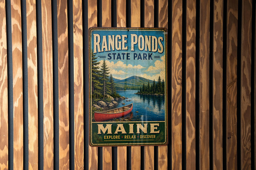 A vintage metal sign for Range Ponds State Park in Maine, featuring a scenic image of a lake with a red canoe and pine trees.