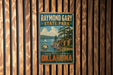 A vintage metal sign for Raymond Gary State Park in Oklahoma, featuring a scenic landscape with a lake and mountains.