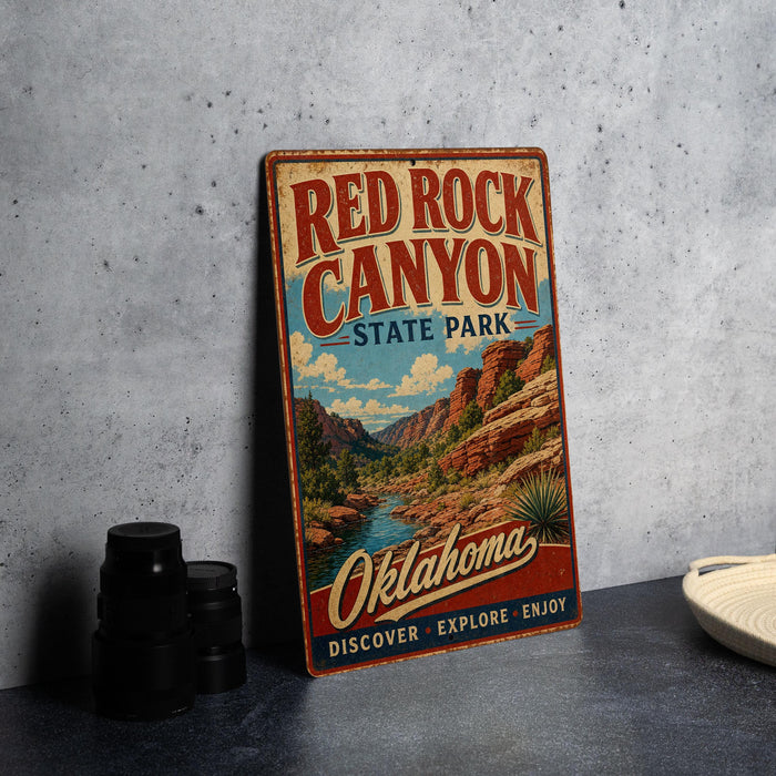 A vintage-style metal sign for Red Rock Canyon State Park in Oklahoma, featuring a scenic illustration of the canyon landscape.