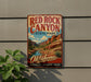 A vintage-style metal sign for Red Rock Canyon State Park in Oklahoma, featuring a scenic illustration of the canyon landscape.