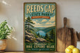 A vintage-style poster advertising Reeds Gap State Park in Pennsylvania, featuring a scenic mountain landscape with pine trees and a lake.