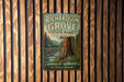 A vintage metal sign for Richardson Grove State Park in California, featuring a scenic illustration of a forest with a bridge and a river.