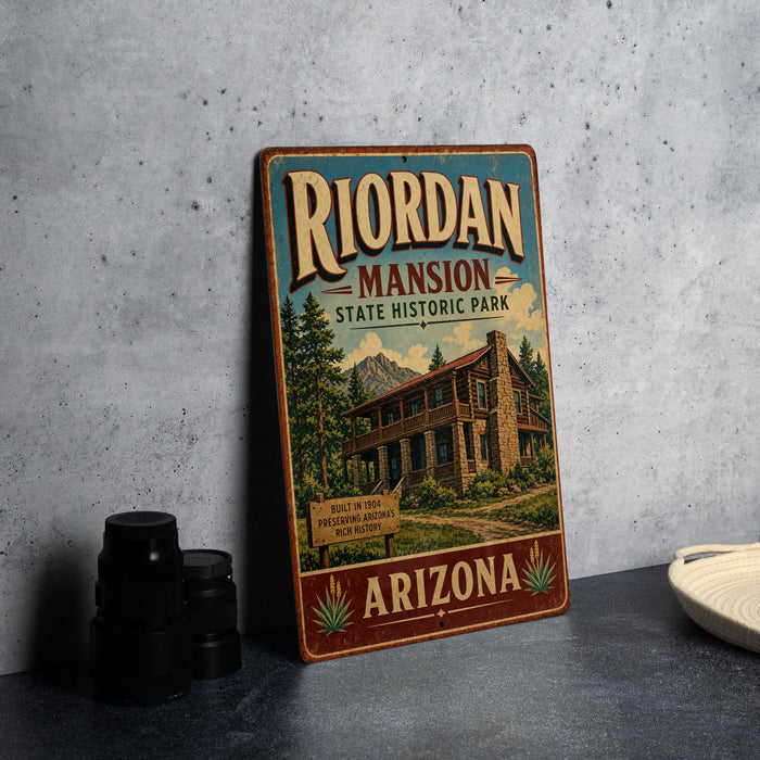 A vintage-style metal sign for the Riordan mansion, a historic park in Arizona, featuring an illustration of the mansion and a mountain backdrop.