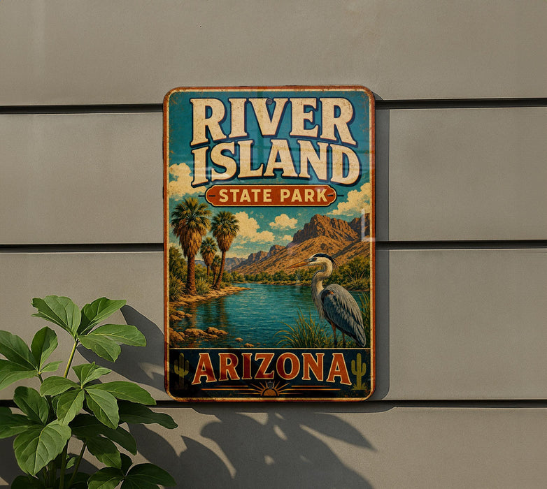 A vintage-style sign for River Island State Park in Arizona, featuring a scenic landscape with palm trees, mountains, and a bird.