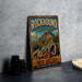 A vintage-style metal sign for Rockhound State Park, featuring a desert landscape with mountains, cacti, and colorful minerals.