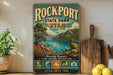 A vintage-style sign for Rockport State Park in Utah, featuring a scenic mountain landscape and water view.