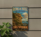 a vintage-style sign for Roman Nose State Park, with a scenic mountain landscape and the text "Roman Nose State Park" prominently displayed.