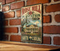 A vintage-style metal sign for Rose Hill Plantation, a historic site in South Carolina, is displayed on a brick wall.