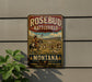 A vintage metal sign for Rosebud Battlefield State Park in Montana, featuring a cowboy on horseback and a scenic landscape.