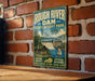 A vintage-style metal sign for Rough River Dam State Resort Park in Kentucky, featuring a scenic illustration of a dam, cabin, and boats.