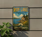 A vintage-style sign for Roy Lake State Park in South Dakota, featuring a scenic landscape with a lake, mountains, and trees.