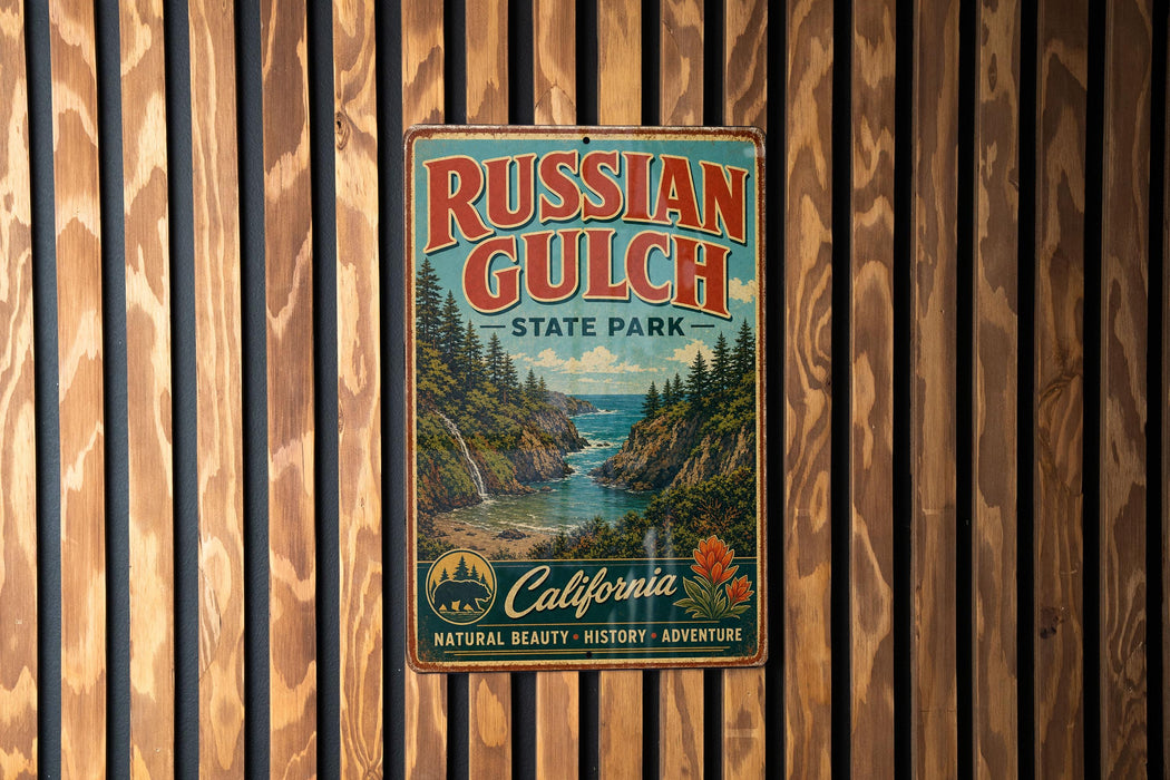 A vintage-style metal sign for Russian Gulch State Park, featuring a scenic landscape with a river, mountains, and pine trees.
