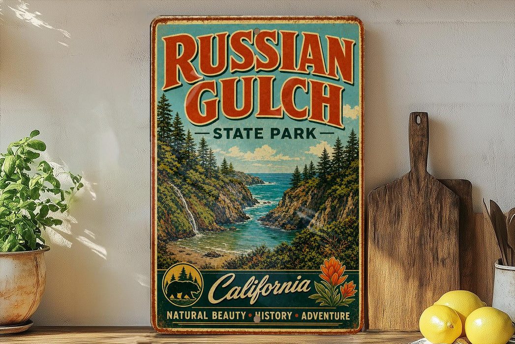 A vintage-style metal sign for Russian Gulch State Park in California, featuring a scenic landscape with a waterfall and pine trees.