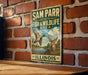 A vintage metal sign for Sam Parr State Fish & Wildlife Area in Illinois, featuring an illustration of a bird and a deer.