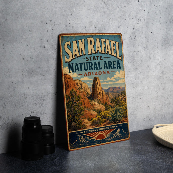 A vintage-style sign for San Rafael State Natural Area in Arizona, featuring a desert landscape with mountains and desert plants.