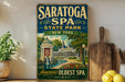 A vintage-style sign for Saratoga Spa State Park in New York, featuring an illustration of the park's architecture and a fountain.