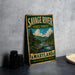 A vintage metal sign for Savage River State Forest in Maryland, featuring a scenic illustration of a river surrounded by pine trees and mountains.