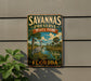 A vintage-style sign for Savannas Preserve State Park in Florida, featuring a bird and a palm tree landscape.