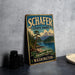 A vintage-style metal sign for Schafer State Park in Washington, featuring a scenic landscape with mountains, pine trees, and a lake.