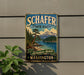 A vintage-style metal sign for Schafer State Park in Washington, featuring a scenic landscape with mountains, pine trees, and a lake.