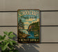 A vintage-style metal sign for Schoolcraft State Park in Minnesota, featuring a scenic landscape with pine trees, a lake, and mountains.