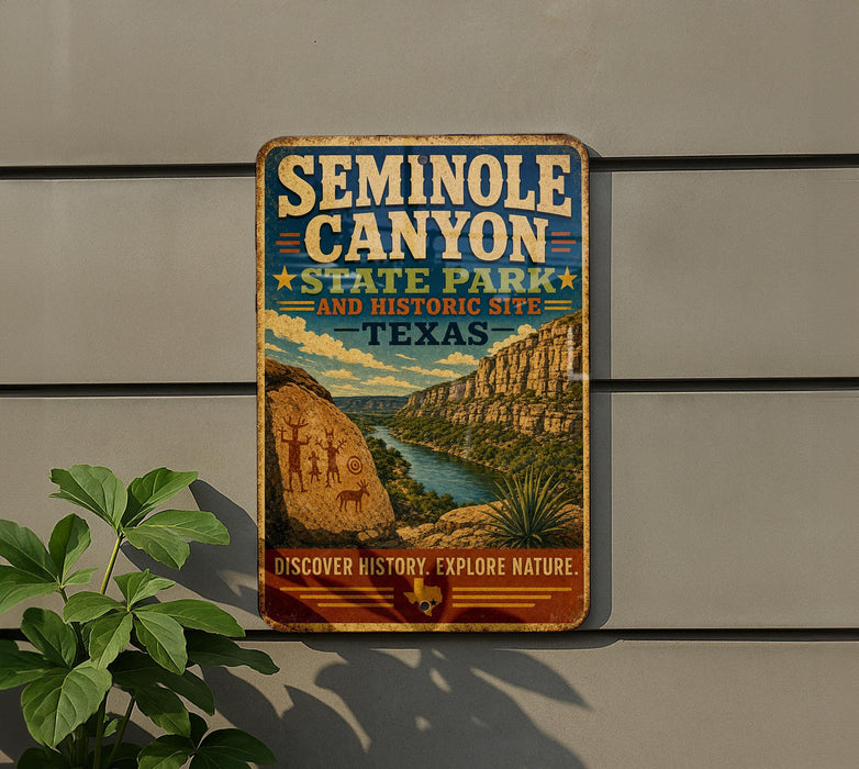 A vintage-style sign for the Seminole Canyon State Park in Texas, featuring a scenic illustration of the canyon landscape.