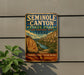A vintage-style sign for the Seminole Canyon State Park in Texas, featuring a scenic illustration of the canyon landscape.