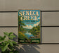 a vintage metal sign for Seneca Creek State Park in Maryland, with a scenic landscape of a river, trees, and flowers.