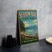 A vintage-style metal sign for Sequim Bay State Park in Washington, featuring a scenic landscape with mountains, pine trees, and a lake.