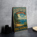 A vintage metal sign for Sequoyah Bay State Park, featuring a scenic landscape with a lake, trees, and boats.