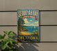 A vintage-style sign for Sequoyah Bay State Park, featuring a scenic landscape with a beach, mountains, and sailboats.