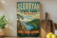 A vintage-style sign for Sequoyah State Park in Oklahoma, featuring a scenic landscape with a mountain, lake, and pine trees.