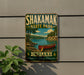 A vintage-style metal sign for Shakamak State Park in Indiana, featuring a canoe on a lake and a scenic landscape.