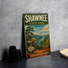 A vintage-style metal sign for Shawnee State Park, Ohio, featuring a scenic landscape with a river, mountains, and a tree.