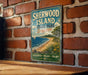 A vintage-style sign for Sherwood Island State Park in Connecticut, featuring a scenic beach and ocean view.