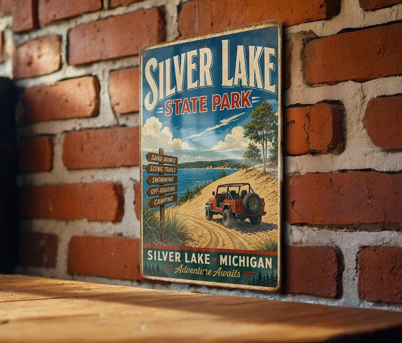 A vintage-style metal sign for Silver Lake State Park, featuring a red jeep and scenic landscape, is displayed on a brick wall.
