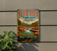 A vintage-style metal sign for Slide Rock State Park in Arizona, featuring a scenic waterfall and desert landscape.