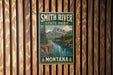 A vintage-style sign for Smith River State Park in Montana, featuring a scenic mountain landscape with a river flowing through it.