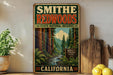 A vintage-style sign for Smithe Redwoods State Natural Reserve in California, featuring a scenic image of the redwood forest and a sign that reads "Project Preserve Enjoy California".