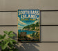 A vintage-style sign for South Bass Island State Park in Ohio, featuring a scenic beach landscape with a lighthouse and boats.
