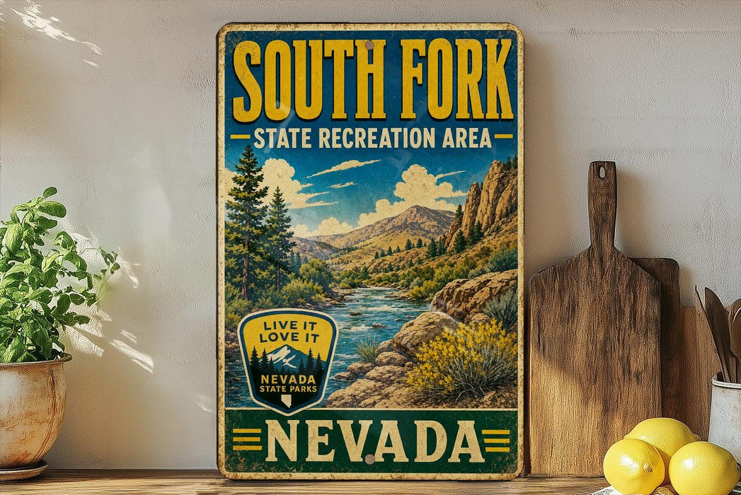 A vintage-style sign for South Fork State Recreation Area in Nevada, featuring a scenic mountain landscape with a river and pine trees.