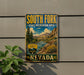 A vintage-style sign for South Fork State Recreation Area in Nevada, featuring a scenic mountain landscape and a river.